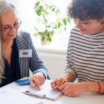 A female volunteer assisting a female applicant